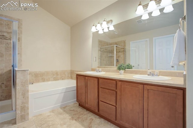 bathroom featuring plus walk in shower, tile patterned flooring, and vanity