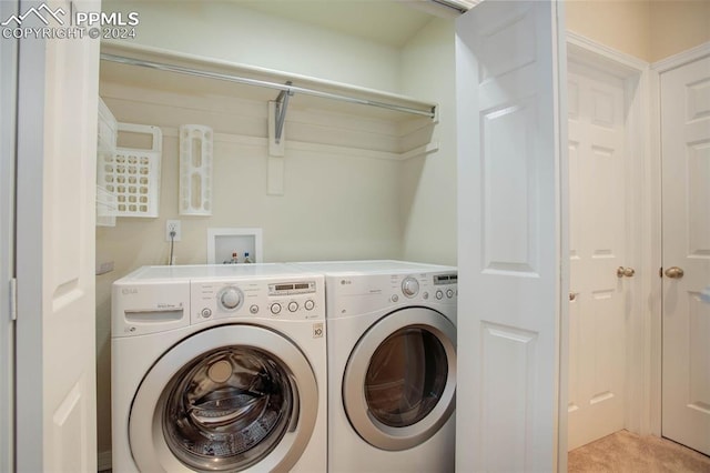 laundry area featuring washing machine and dryer