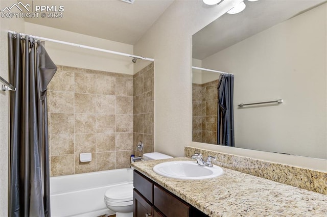 full bathroom with vanity, toilet, and shower / bath combo with shower curtain