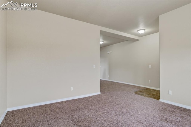 empty room featuring carpet flooring