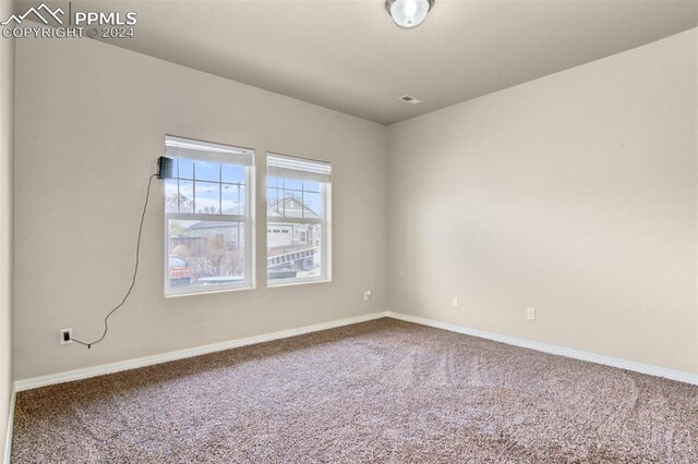 view of carpeted spare room