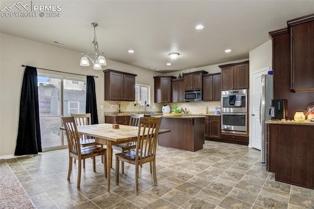 dining space featuring a notable chandelier