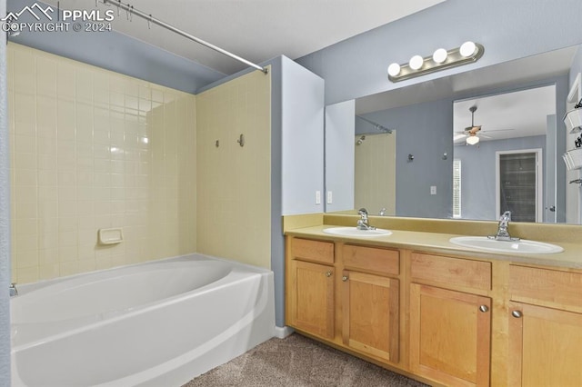 bathroom featuring vanity, ceiling fan, and shower / bath combination