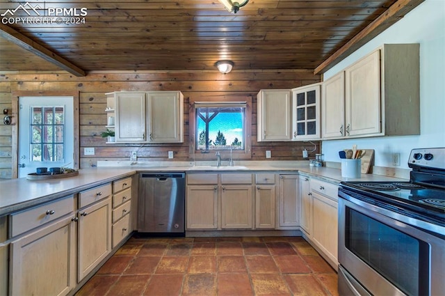 kitchen with wood walls, sink, wooden ceiling, and appliances with stainless steel finishes