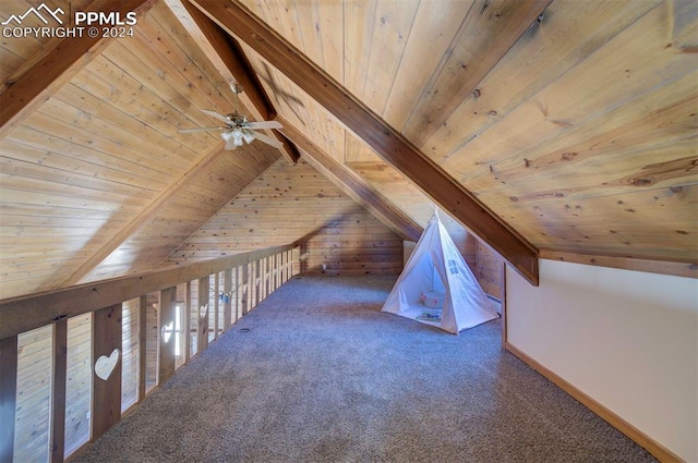 additional living space with carpet flooring, vaulted ceiling with beams, wood walls, and wooden ceiling