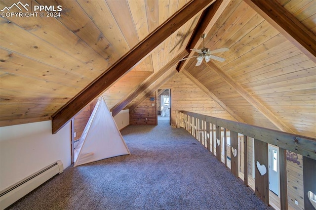 additional living space with baseboard heating, vaulted ceiling with beams, wooden walls, and wooden ceiling