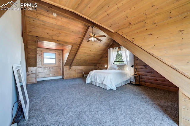 unfurnished bedroom featuring lofted ceiling with beams, wood walls, wood ceiling, and multiple windows