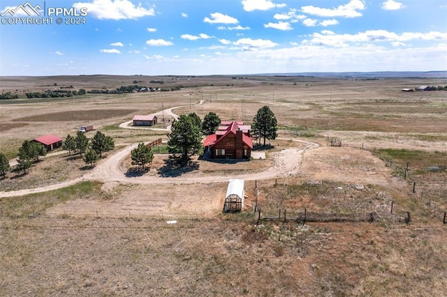 birds eye view of property featuring a rural view