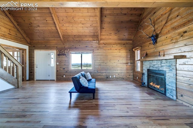 unfurnished room with beam ceiling, wooden ceiling, hardwood / wood-style flooring, and wooden walls