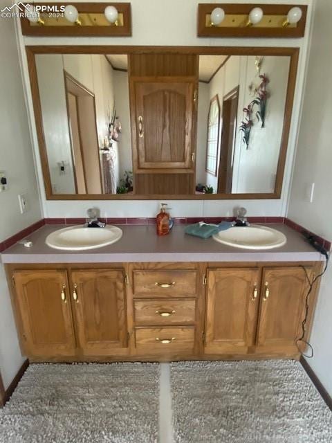 bathroom featuring dual vanity