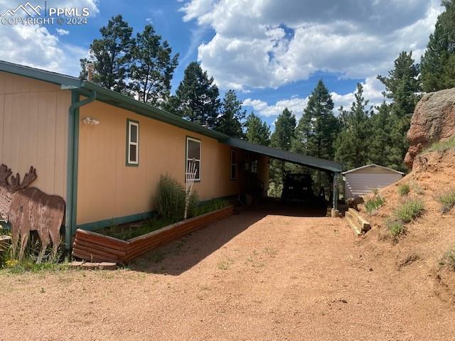 view of home's exterior with a carport