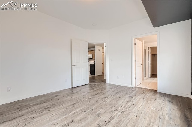 unfurnished bedroom with light hardwood / wood-style floors