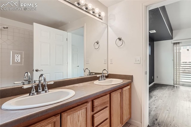 bathroom with vanity and hardwood / wood-style flooring