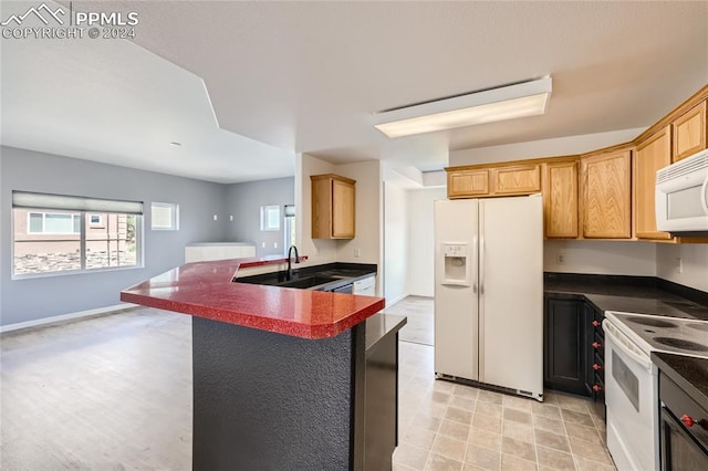 kitchen featuring white appliances and sink