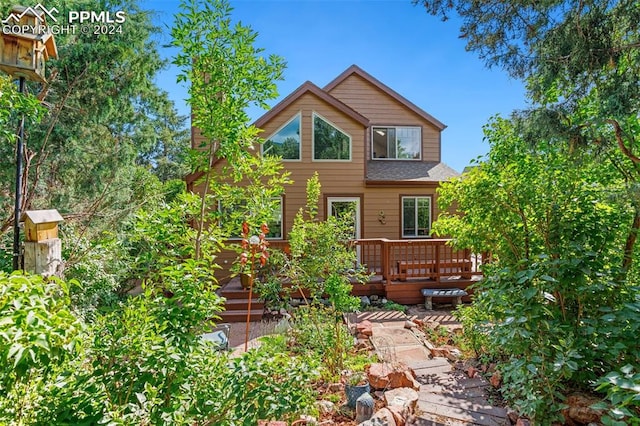 back of house with a wooden deck