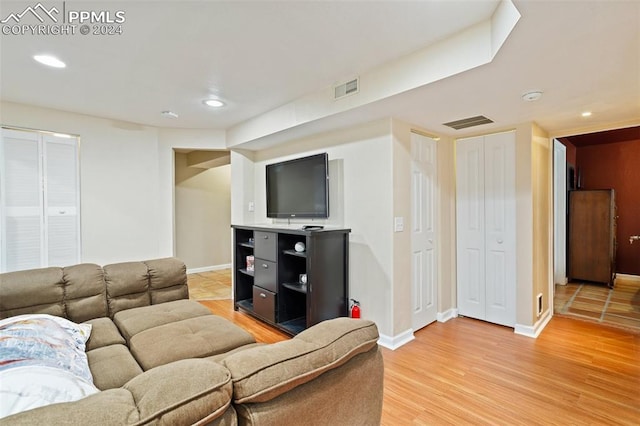 living room with light hardwood / wood-style flooring