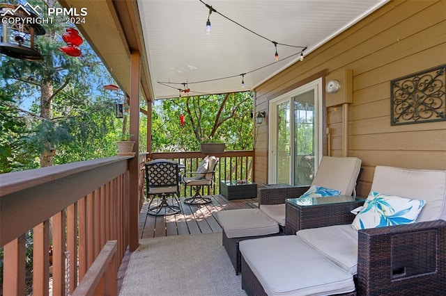 wooden terrace featuring an outdoor hangout area