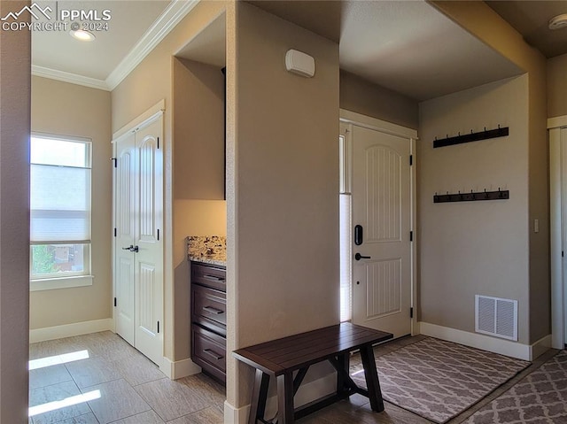 foyer entrance with ornamental molding