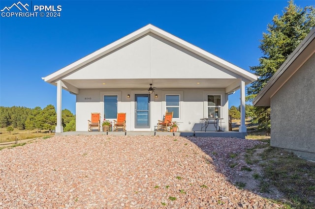 back of house with a porch