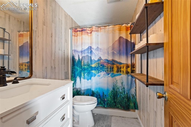 bathroom featuring vanity, toilet, and a shower with shower curtain