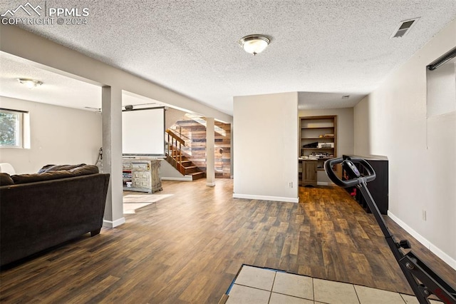 interior space with dark hardwood / wood-style floors and a textured ceiling