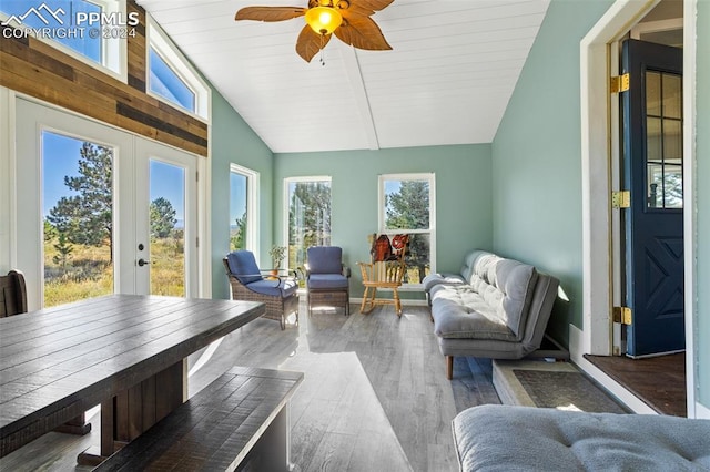 sunroom with vaulted ceiling, a healthy amount of sunlight, ceiling fan, and french doors