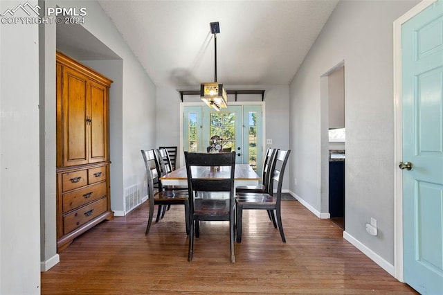 dining space featuring dark wood-type flooring