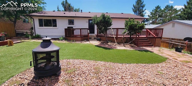 view of yard featuring a wooden deck