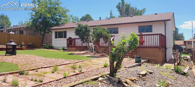 rear view of house with a yard