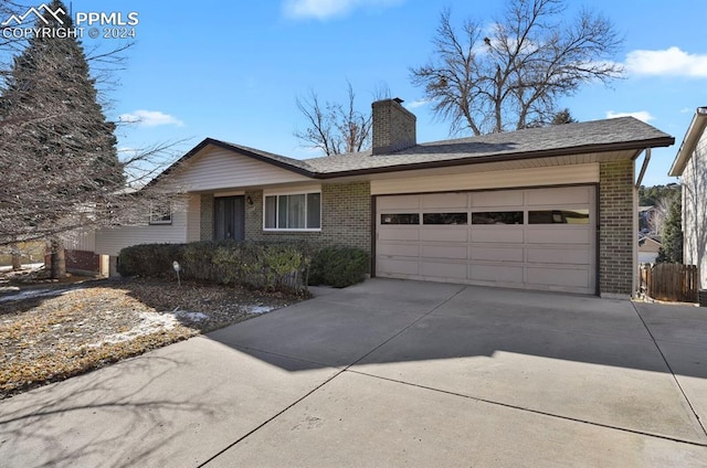 single story home featuring a garage