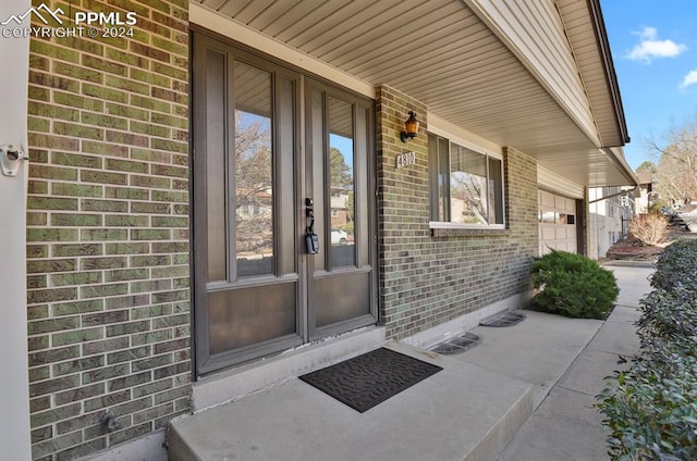 entrance to property featuring covered porch