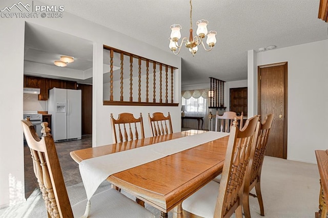 carpeted dining room with a textured ceiling and a notable chandelier