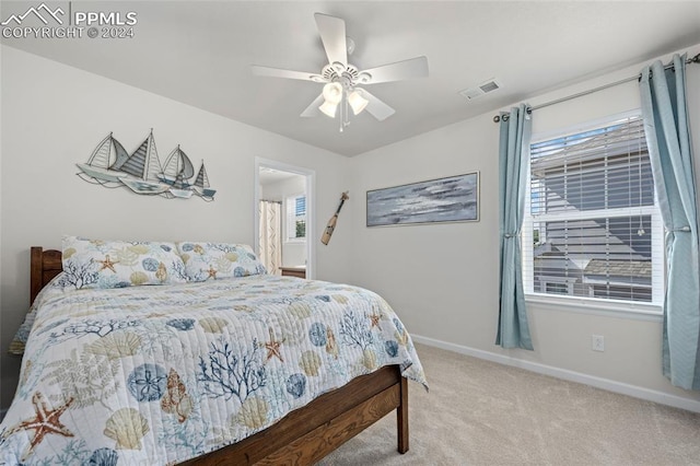 carpeted bedroom featuring ceiling fan