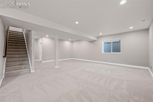 basement with light carpet