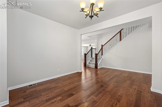 interior space with dark hardwood / wood-style flooring and an inviting chandelier