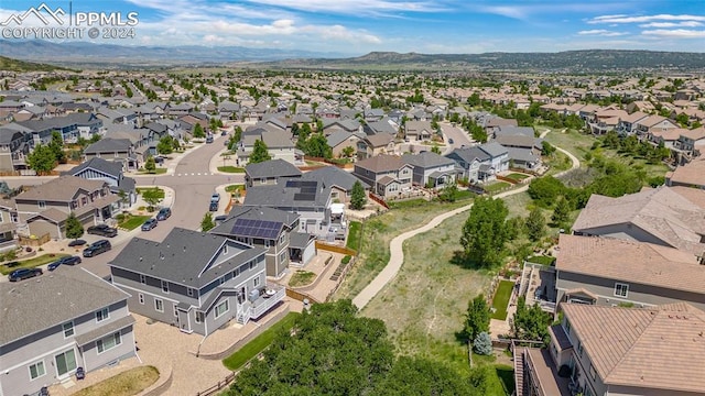 birds eye view of property featuring a mountain view