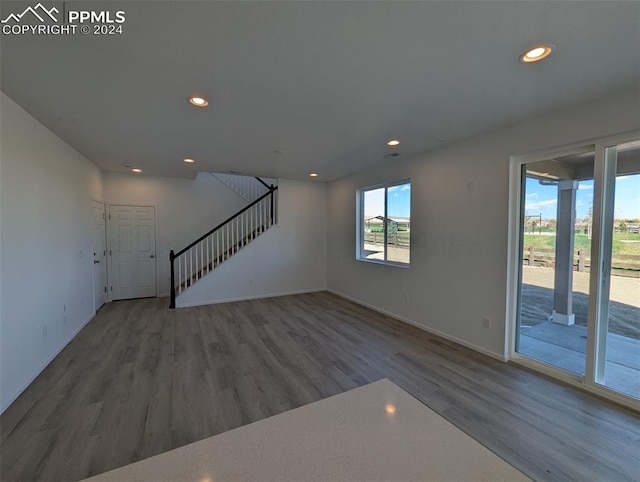 unfurnished living room featuring hardwood / wood-style floors