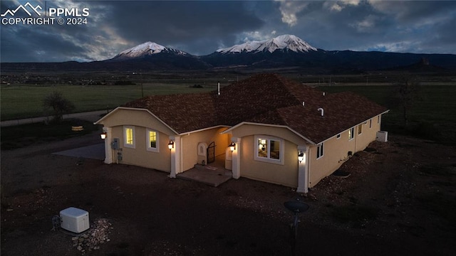 ranch-style home featuring a mountain view