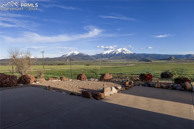 view of front of house with a mountain view and cooling unit