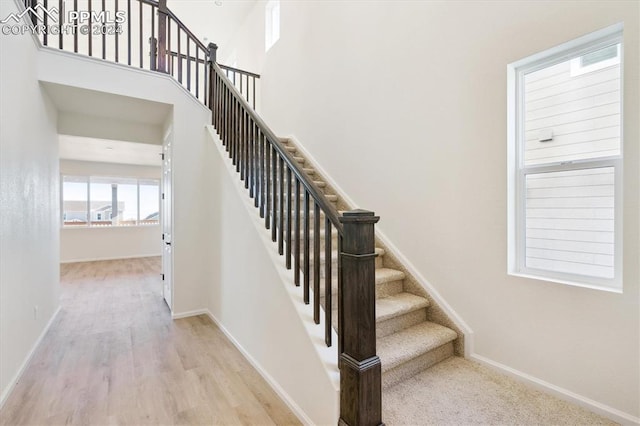 stairway featuring wood-type flooring