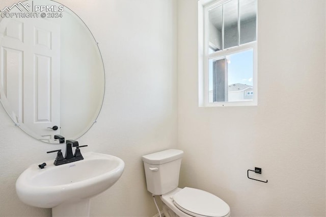 bathroom with toilet and sink