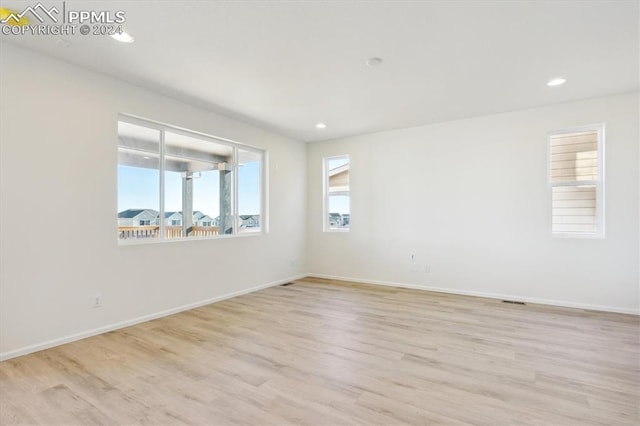 unfurnished room featuring light hardwood / wood-style flooring