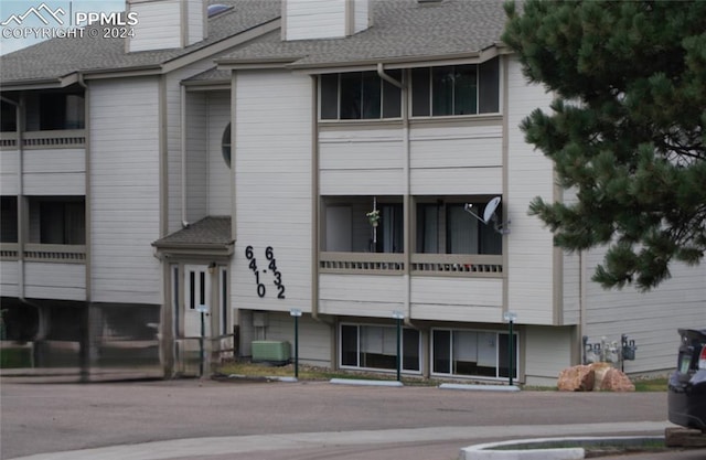 view of building exterior with central air condition unit