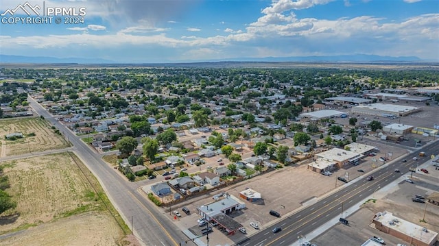 birds eye view of property with a mountain view