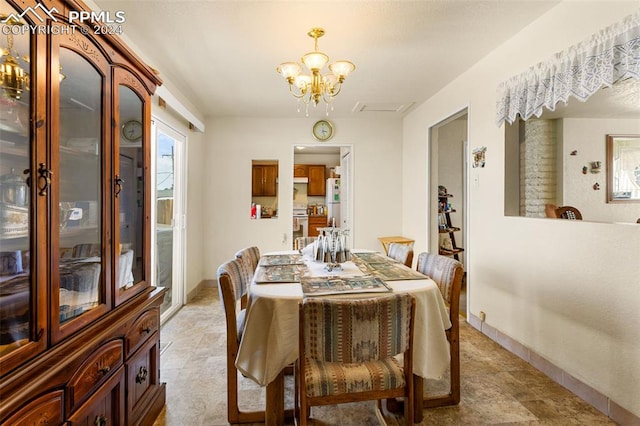 dining area featuring a chandelier