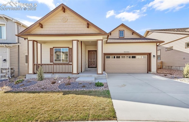 view of front of house with a porch, an attached garage, concrete driveway, and a front lawn