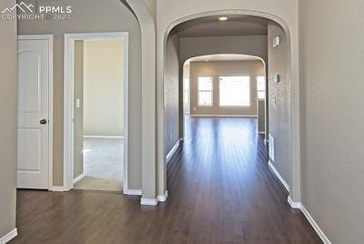 hallway featuring dark hardwood / wood-style floors