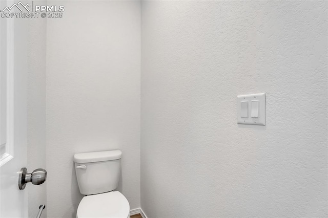 bathroom featuring toilet