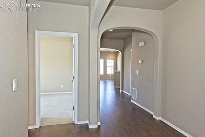 hallway with dark wood-type flooring