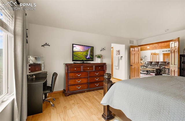 bedroom with light hardwood / wood-style floors